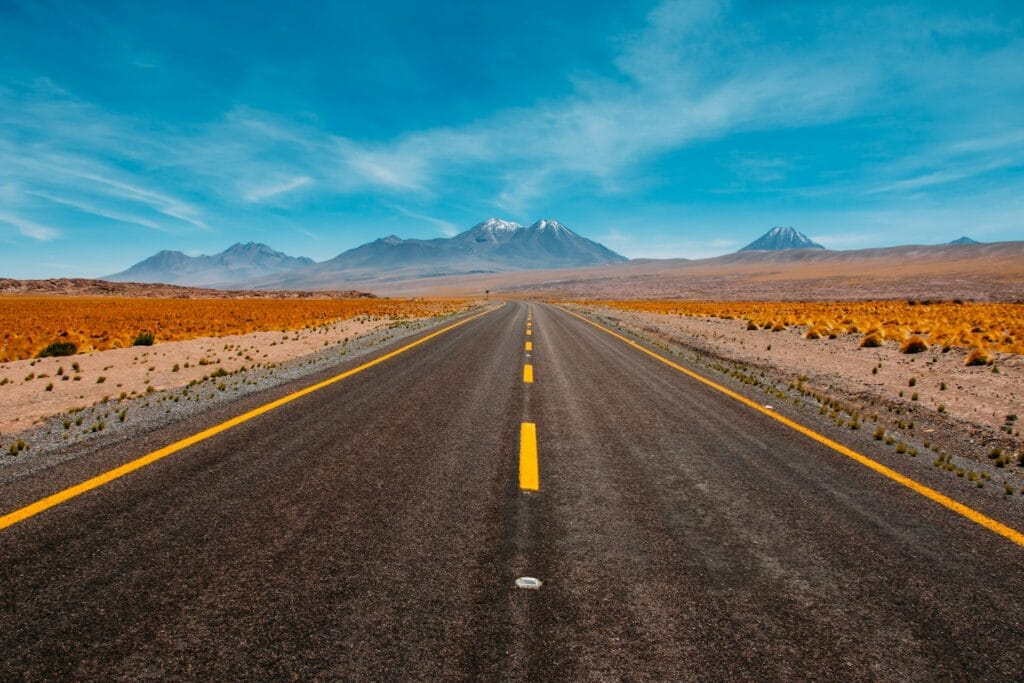 Image of a road facing a mountain on the horizon