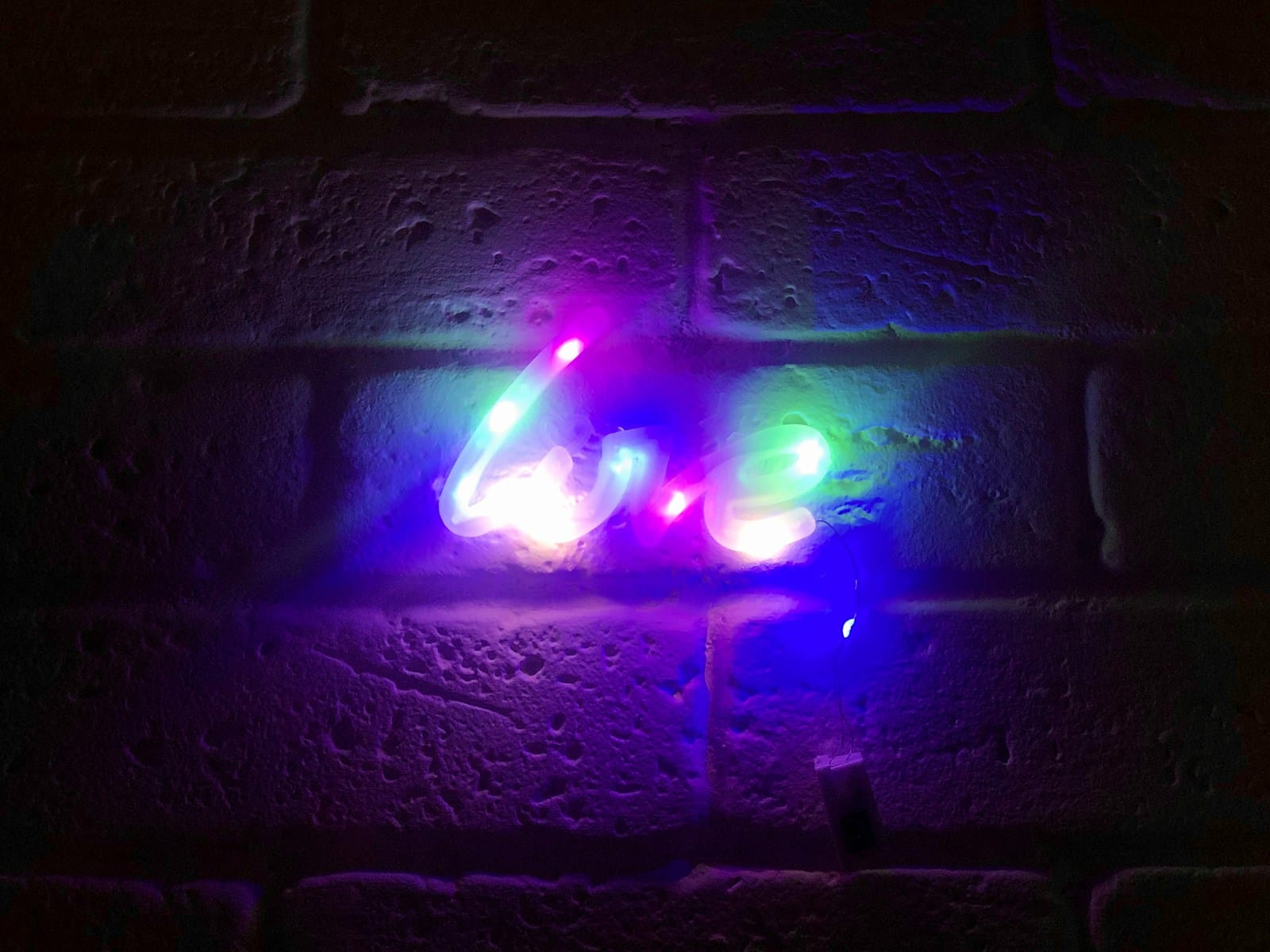 a brick wall with some lights on it